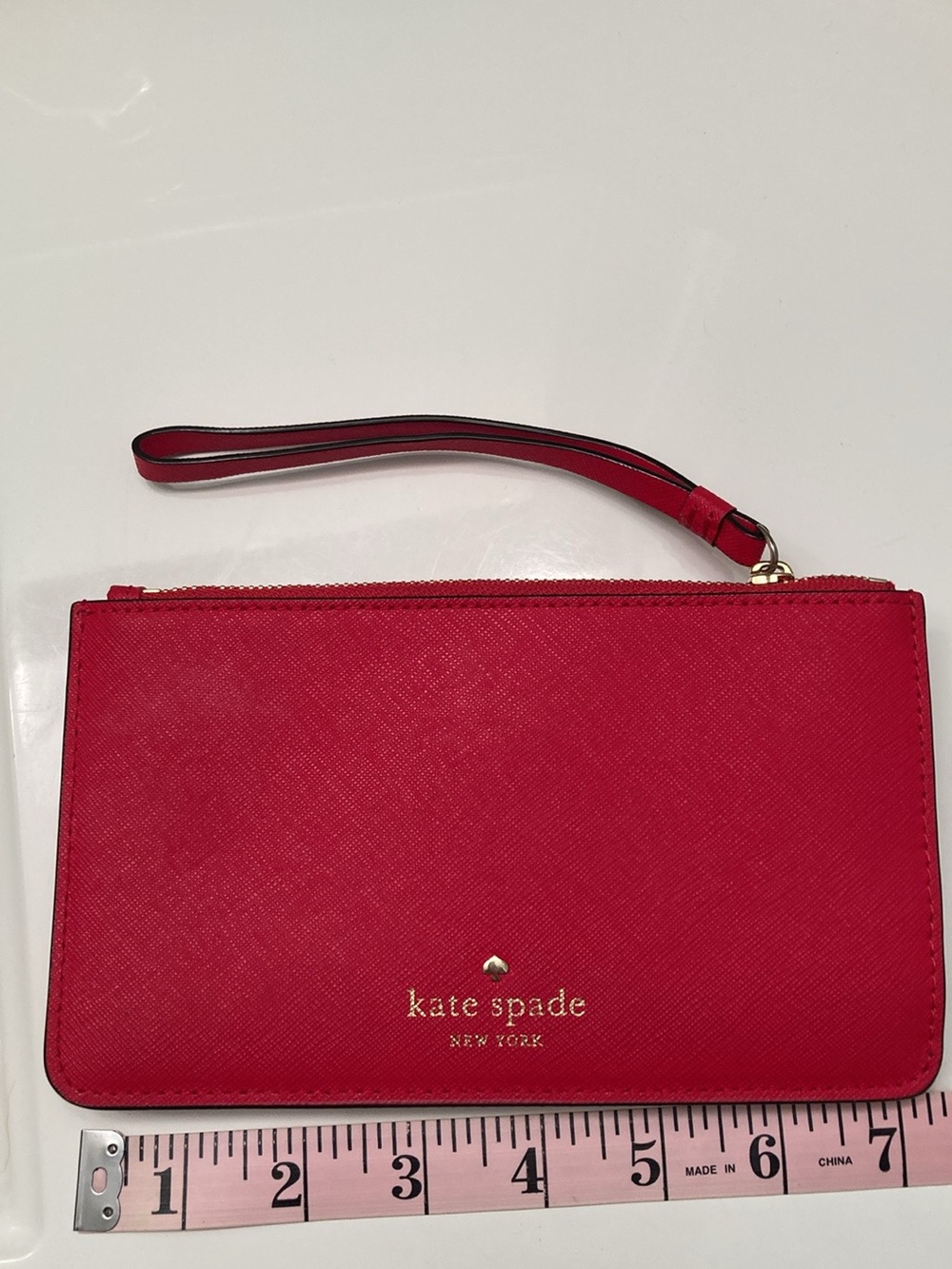 kate spade red zip wristlet with gold logo